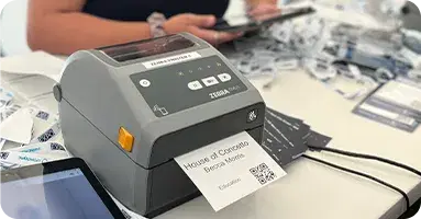 On-site badge printing with Zebra printer at event registration desk