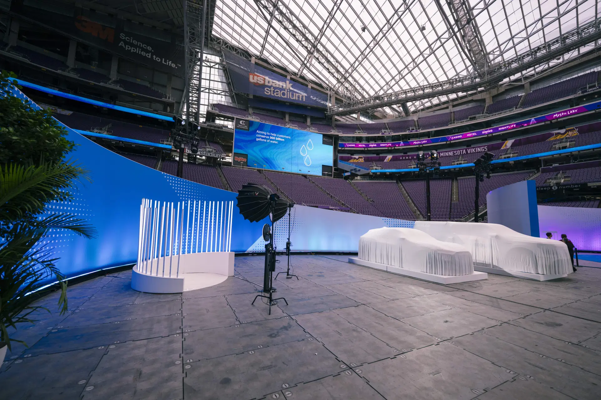 Photo booth setup at US Bank Stadium with branded stage and ring lights